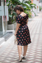 Load image into Gallery viewer, back view of plus size black and red heart print satin midi dress with puff sleeves