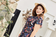 Load image into Gallery viewer, Plus size black floral print faux wrap dress with ruffles