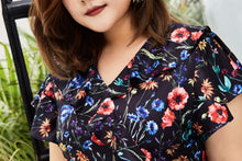 Load image into Gallery viewer, close up of Plus size black floral print faux wrap dress with ruffles