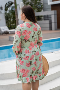 back view of plus size green and pink floral print baby doll dress