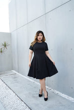 Load image into Gallery viewer, Plus Size EmerBlack Cocktail Dress with Jacquard Sleeves and Inverted Pleats
